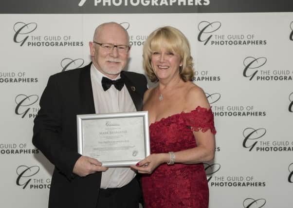 Mark Bannister with his award from The Guild of Photographers.
