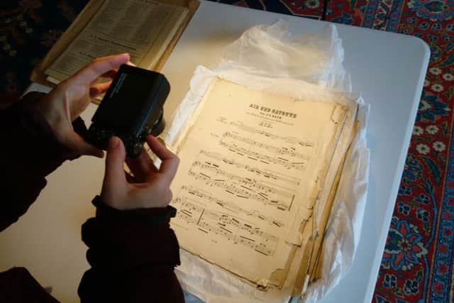 Pouring over Gunby Hall's musical heritage. Picture: National Trust