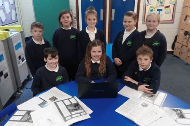 St Thomas' CofE School pupils with their work.