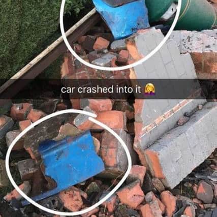 Pieces of the crashed vehicle left behind after the collision with the bus shelter. Photo: Donna Mosley. EMN-190502-161215001