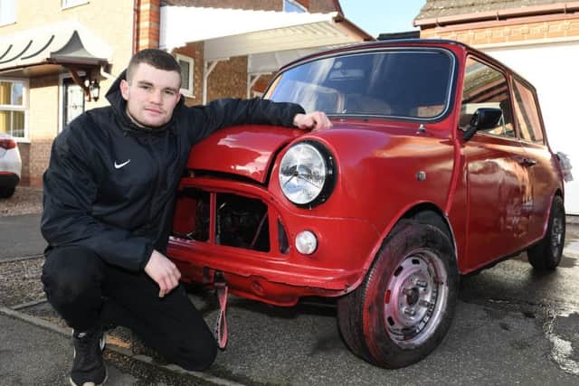 Young Restorer of the Year 2018, Josh Smith of Sleaford, pictured with his Mini that he is restoring. EMN-191102-095627001