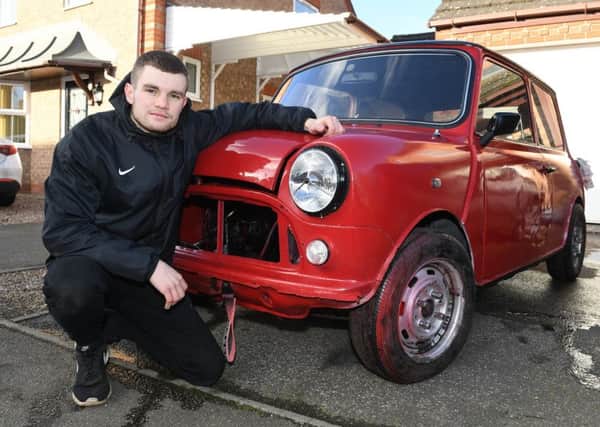 Young Restorer of the Year 2018, Josh Smith of Sleaford, pictured with his Mini that he is restoring. EMN-191102-095627001
