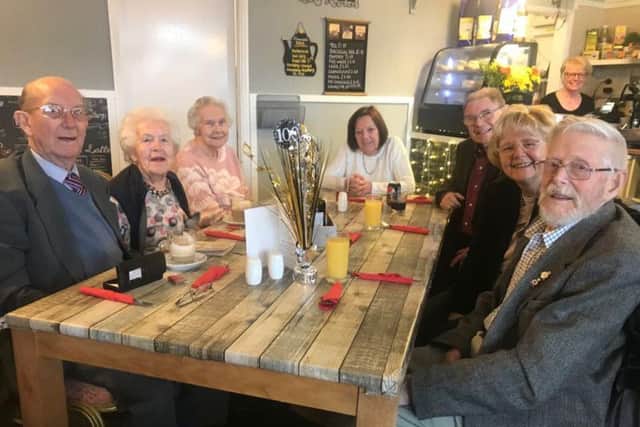 Len Harper (right) celebrates his 100th birthday with family and friends.