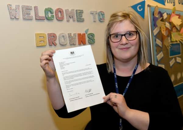 Brown's School headteacher Sally Howley with letter of commendation from Education Secretary. EMN-190802-095639001