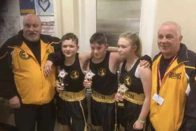 The young boxers in Newark with coaches John Sutton and Kevin Smith.