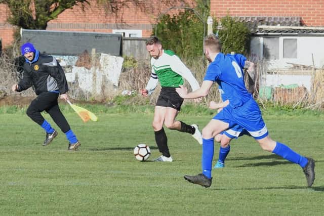 Swineshead (blue) v Pointon (green). James Waby (blue), Nathan Wilson (green)