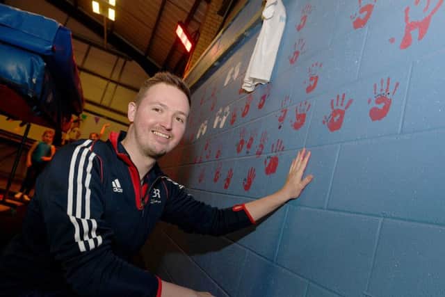 Big Jump Trampoline Club officially opened by olympic trampoline coach Paul Greaves, pictured putting his hand print on the wall. EMN-191102-095741001