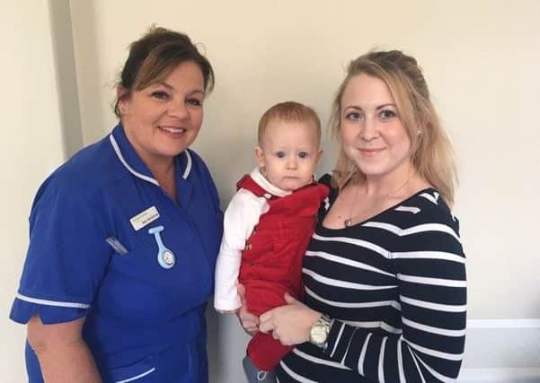 Quarrington midwife Mary McGillivray with Sophie Ransen and baby Noah.  Image supplied.