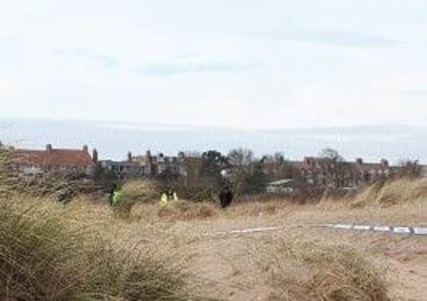 Police on the beach new the boat compound in Skegness. ANL-191202-134030001