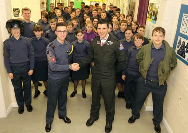 Flt Lt Jim Peterson is thanked for his visit to Sleaford ATC by Cadet Warrant Officer Sam Hurry - the most senior cadet in the unit. EMN-190215-161559001