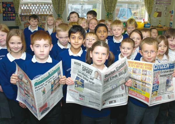 Read all about it! Some of the youngsters get to grips with the Boston Standard, the Poacher Express and The Citizen 10 years ago.