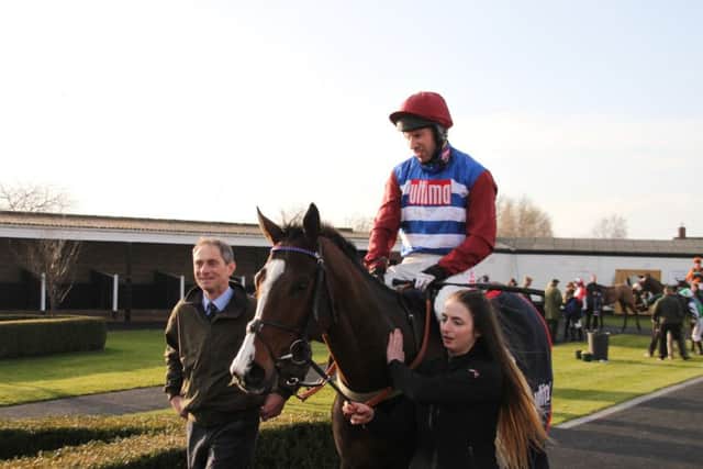 Winner of the £21,800 Market Rasen Town Council Handicap Hurdle Dino Velvet returns to the winners enclosure with Wayne Hutchinson on board.