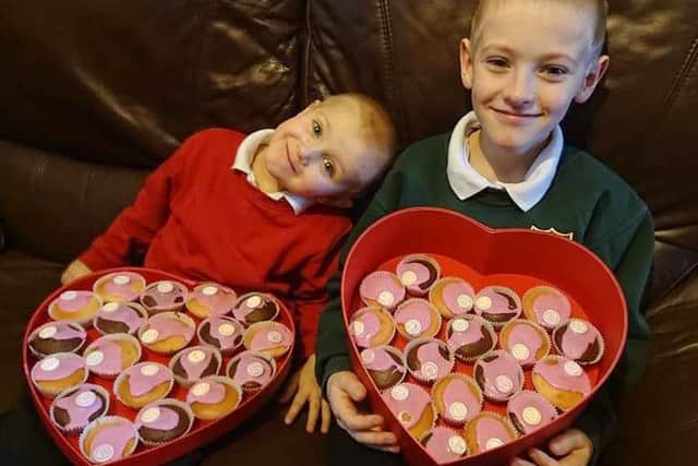 Eight-year-old Callum Drew (right), with his brother Luke.