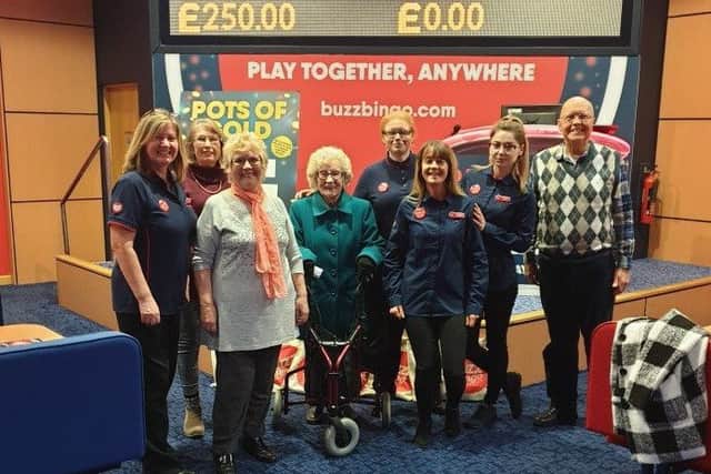 Guest of honour Deanna Kenny, of Boston, (third from left) with fellow customers and Buzz Bingo colleagues.