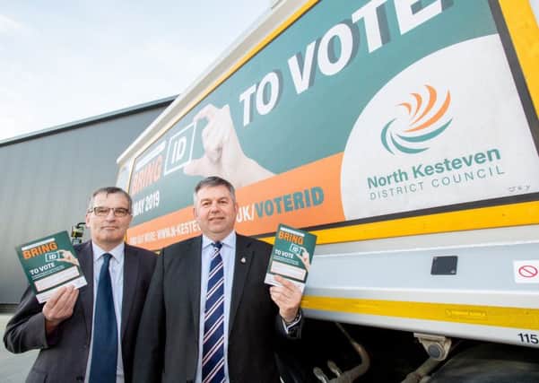 NKDC Chief Executive Ian Fytche (left) and Leader Coun Richard Wright launch the district's voter ID pilot using posters on bin lorries. EMN-190226-133451001