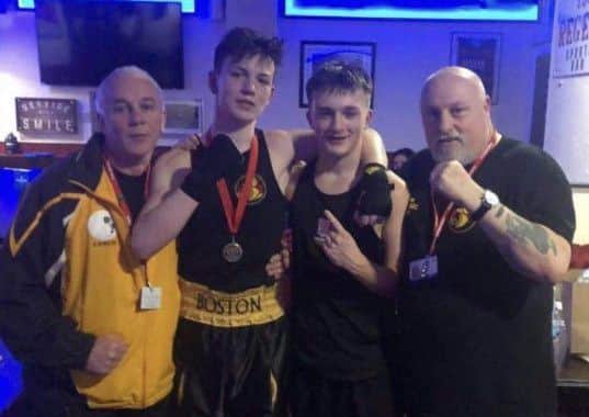 Dylan Harmon with Owen Shaw and the Boston coaches.