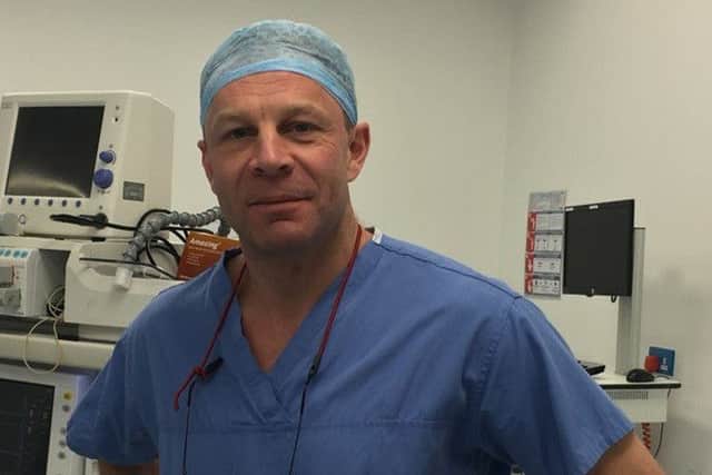 Charles Knowles, in his scrubs.