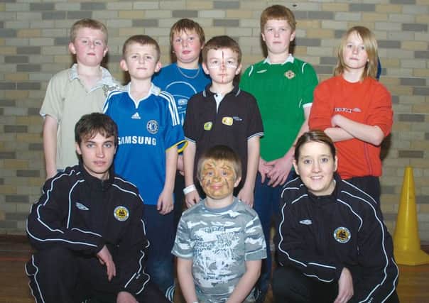 Bobby Smith and Nicola Drummond, Boston United community coaches, with youngsters 10 years ago.