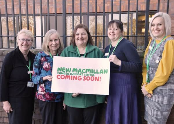 The Macmillan cancer information and support team standing outside the site where the new support centre will be located. Images supplied.