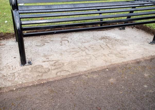 The damage to the concrete surrounding the memorial bench opposite Stanhope Hall, in Horncastle. Picture: John Aron. EMN-190221-110211001
