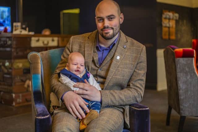 Boston's Lee Melton with son Buddy.