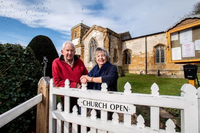 Penny Would (Secretary to the District Church Council) and David Would outside St Andrews Church.