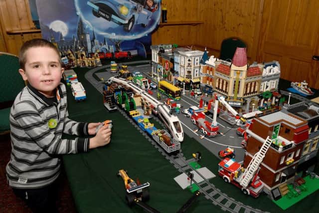 Elliott Halgarth, seven, with his Lego model.