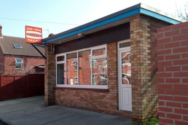 The Queen Street fish and chip shop in Sleaford where two female staff say they were confronted by a man brandishing a gun.