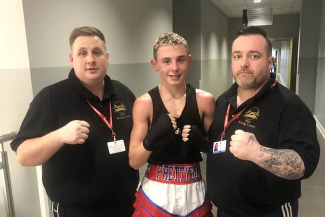 Elding is pictured with his coaches Colan Forman and Harry Harrison.