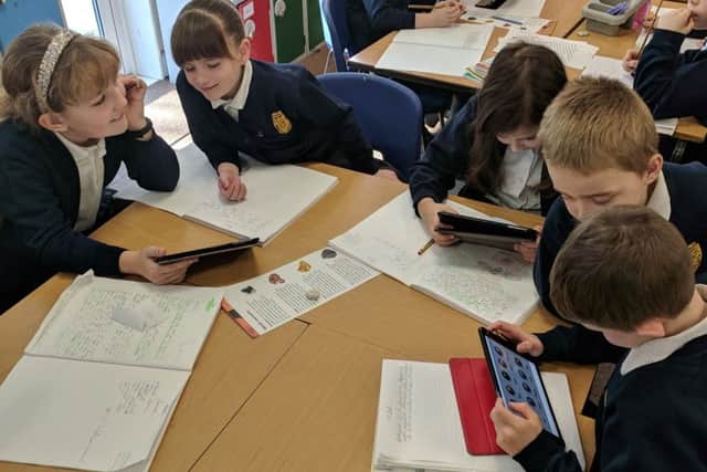 Children in Daffodils Class at Browns School, Horbling,researching metals for their Mighty Metals topic. EMN-190226-113158001