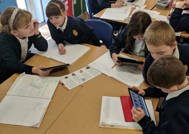 Children in Daffodils Class at Browns School, Horbling,researching metals for their Mighty Metals topic. EMN-190226-113158001