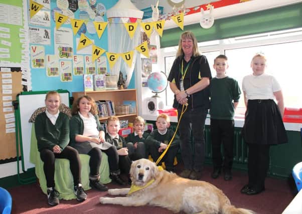Angus and Mandy with Lacey Gardens pupils during their weekly visit.