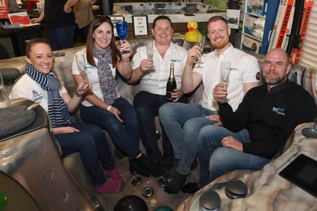 1Stop Spas, Billinghay. Tenth anniversary open event. L-R Laura Stephenson, Melissa Brady, Chris Brady, Callum Pryme and John Duncan, celebrating after announcing the move to Sleaford. EMN-190403-102002001