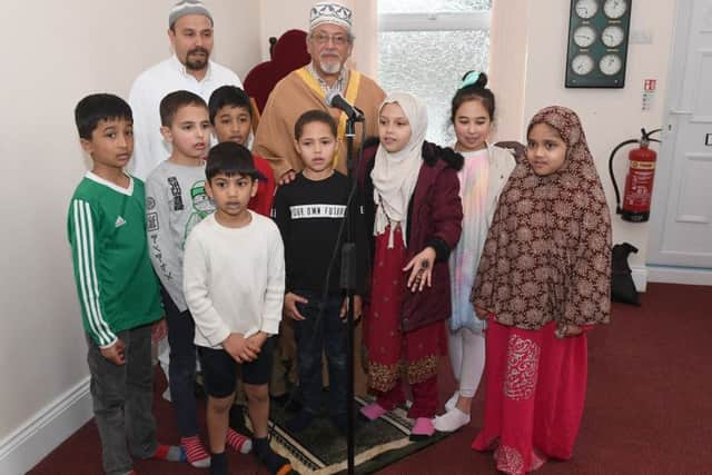 Sleaford Islamic Centre, open to visitors as part of Visit My Mosque day. Children with L-R Noureddine Belazizia and Dr Mostafa Morsy. EMN-190403-102126001