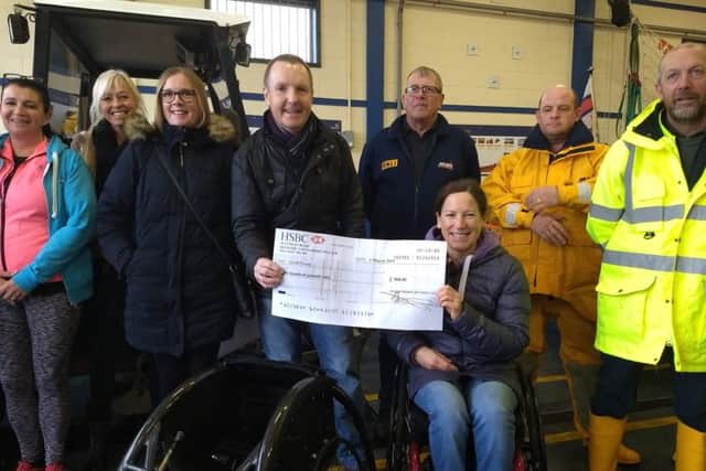 Mablethorpe Running Club chairman Wayne Kew with para-athlete Liz McTernan EMN-190403-163442002