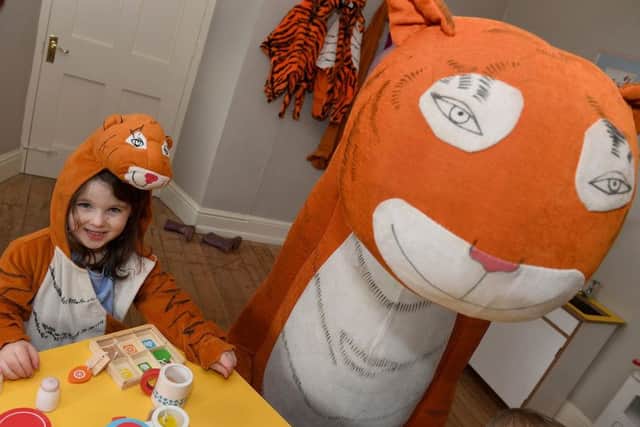 Four year-old Amelia Jones enjoying The Tiger who came to Tea event at Gunby Hall.