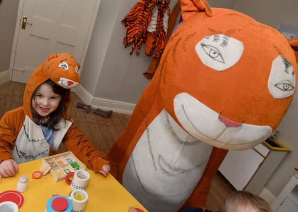 Four year-old Amelia Jones enjoying The Tiger who came to Tea event at Gunby Hall.