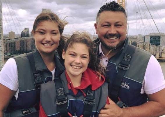 Alistair Arundell pictured with his two daughters.