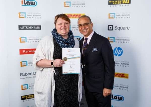 Jo Slesser receives the Small Business Sunday award from Dragons Den entrepreneur Theo Paphitis.