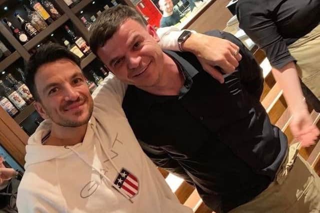 Andre poses for a photo with San Rufo's co-owner Servet.