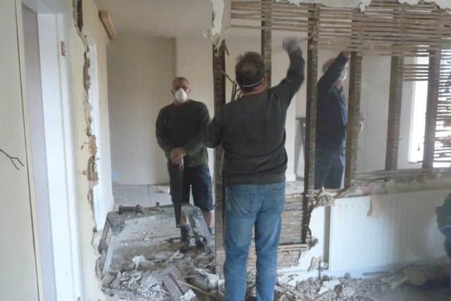 Volunteer villagers hard at work on renovations at The Thorold Arms, Harmston. EMN-191003-160502001