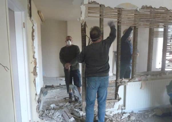 Volunteer villagers hard at work on renovations at The Thorold Arms, Harmston. EMN-191003-160502001