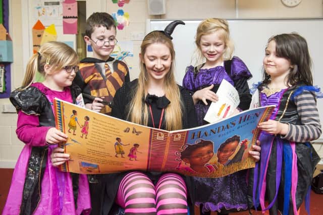 Year One pupils Phoebe Gill, Cameron Harvey, Olivia Randle and Elissia Alan enjoy an exciting story at Theddlethorpe  Academy.