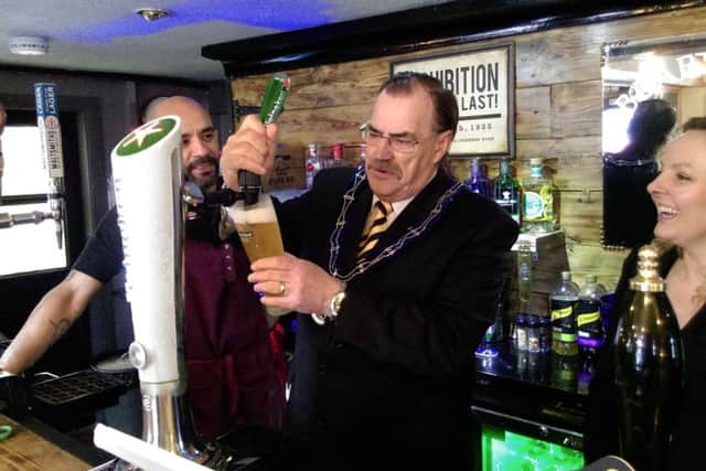 The Mayor of Louth, Councillor George Horton, pulls the first pint.