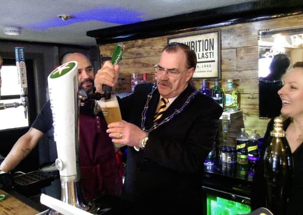 The Mayor of Louth, Councillor George Horton, pulls the first pint.