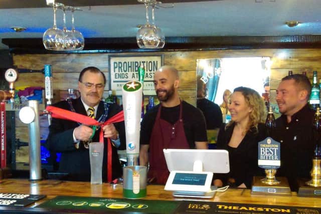 Mayor of Louth, Coun George Horton, cut the ribbon last Friday (March 8) alongside Marlon and Gemma Jones, the new owners of the Boars Head.