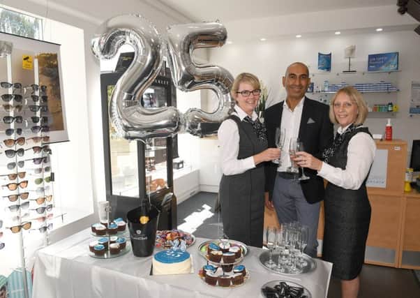 Lunettes Opticians, Sleaford, celebrating their 25th anniversary two years ago. From left - Louise McCarrick, Tushar Majithia - owner,and  Janet Ratcliffe. EMN-191203-141820001