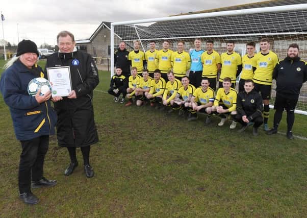 Wyberton FC presented with Lincolnshire Football Leagure Team of the Month award. L-R Committee member Malc Creasey, receiving the award from Referees and Fixtures Secretary Terry Knott.