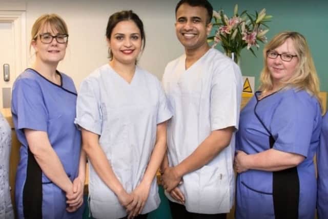 Smitha Susan Mathew and Manu Cherian with staff at the Horncastle practice. EMN-191103-154540001