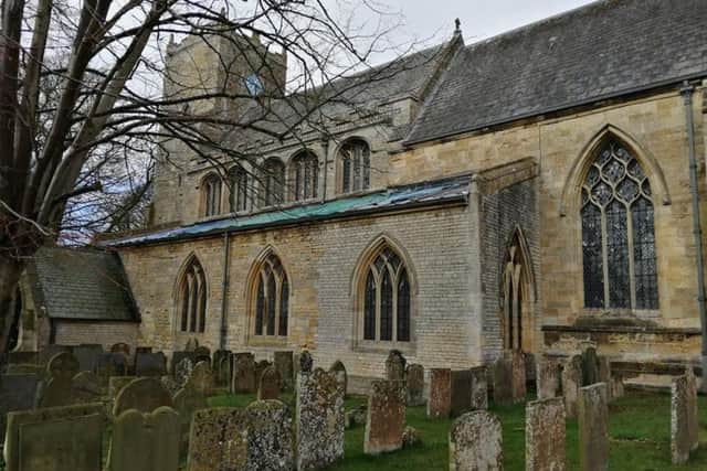 Navenby Church, now with temporary sheeting on after the lead theft from the roof. EMN-191103-180920001